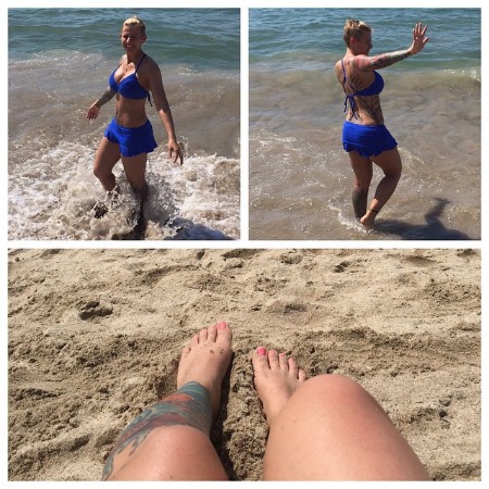 Christie Brimberry on the beach showcasing her lovely tattoos.